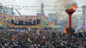 Hundreds of people gathered in Amed, Bakûr (Kurdistan in Turkey), in 2022 to celebrate Newroz. They waved flags of Kurdish political parties and the Kurdish national flag. In Turkey and Iran, publicly displaying the Kurdistan flag can carry serious risks. Photo: ANF/Firat.